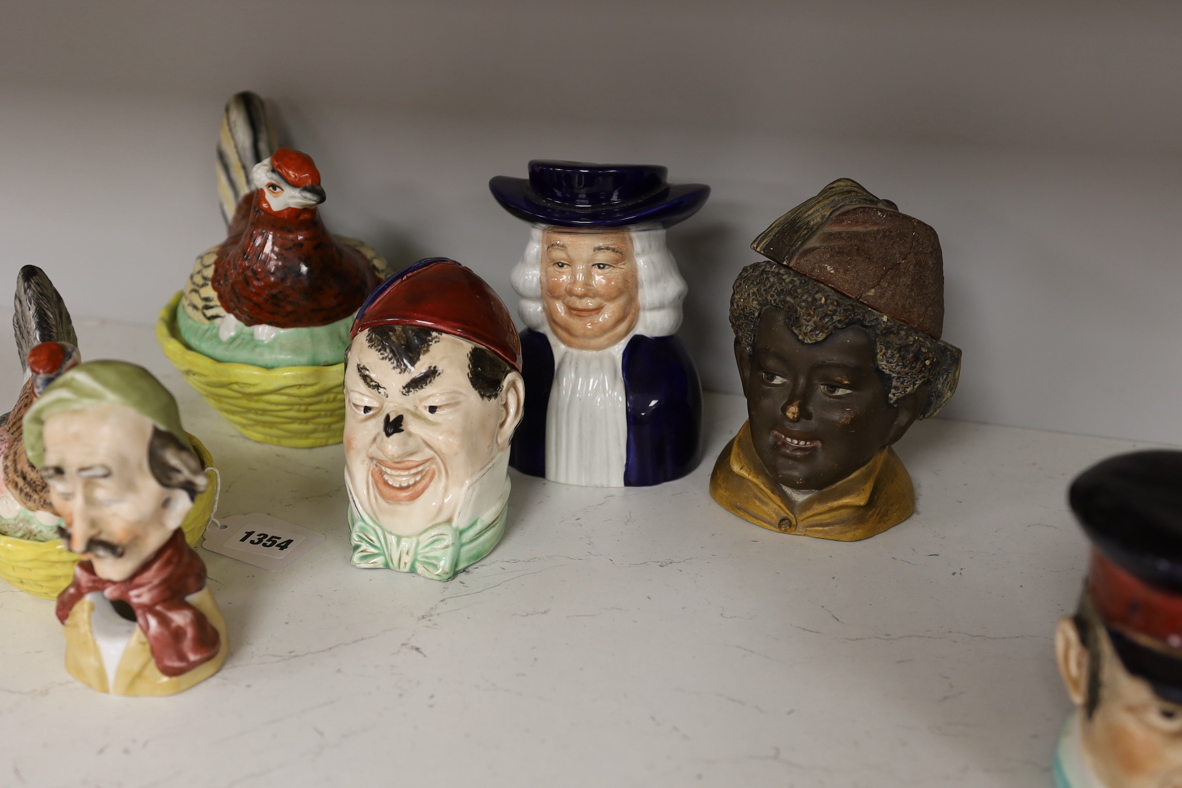 Two 19th century Staffordshire hen egg baskets and covers and a group of 19th/20th century novelty character pots